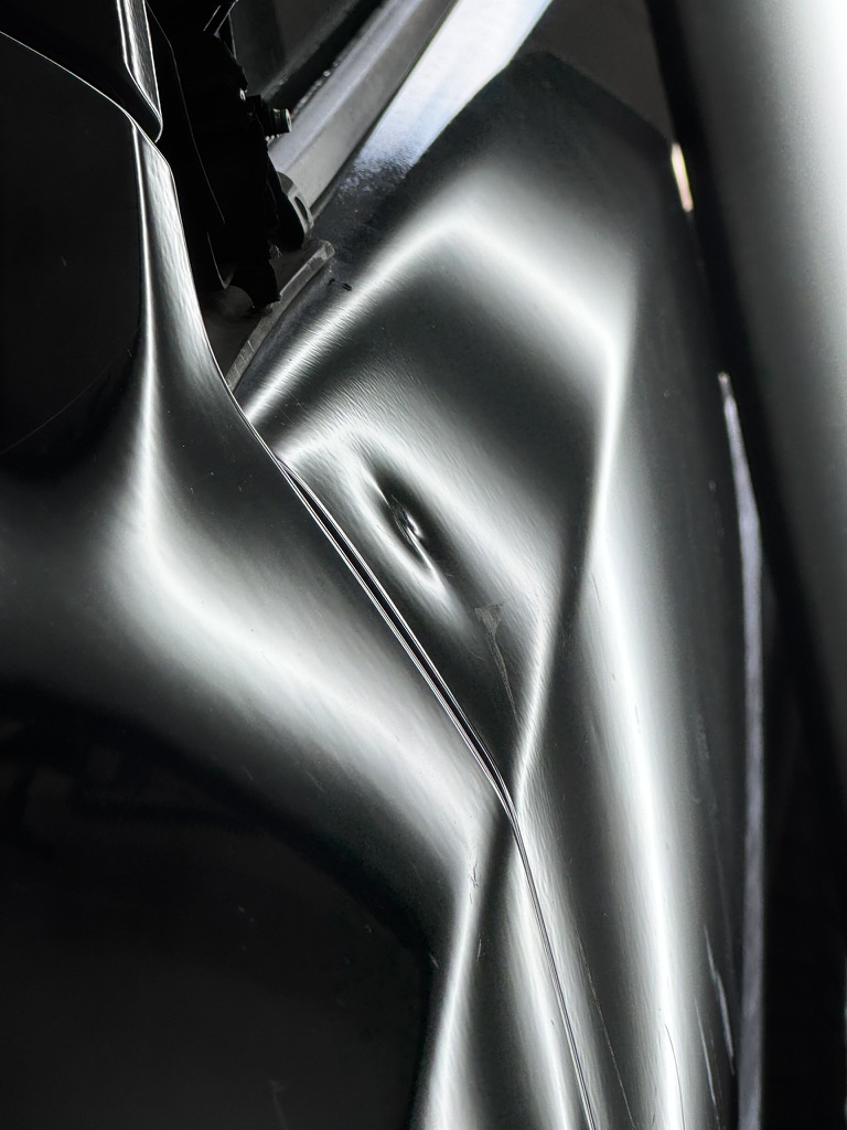 Deep dent in a narrow vehicle panel opening